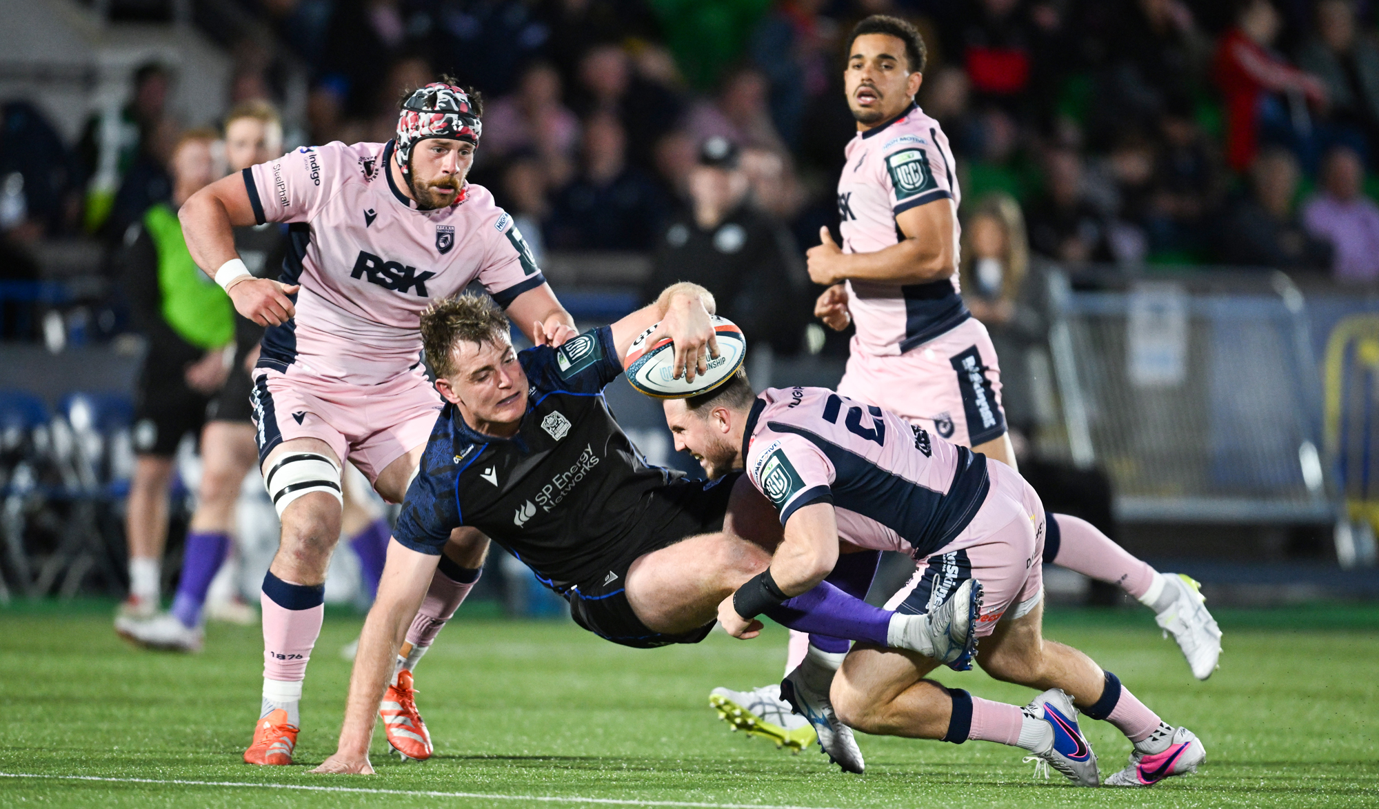 Glasgow Warriors Stafford McDowall is tackled by Cardiff players during the May 2026 URC match
